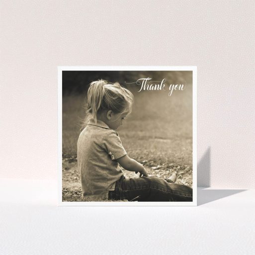 Communion Thank You Card Design - "Centralised Frame" A communion thank you card design named "Centralised Frame". It is a square (148mm x 148mm) card in a square orientation. It is a photographic communion thank you card with room for 1 photo. "Centralised Frame" is available as a folded card, with mainly white colouring.