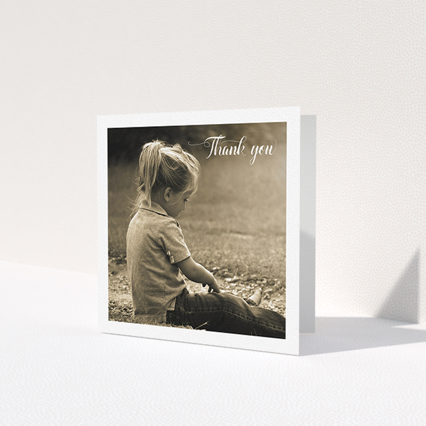 A communion thank you card design named 'Centralised Frame'. It is a square (148mm x 148mm) card in a square orientation. It is a photographic communion thank you card with room for 1 photo. 'Centralised Frame' is available as a folded card, with mainly white colouring.