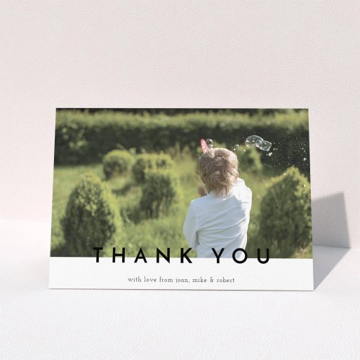 Communion Thank You Card Design - "Cross Border" A communion thank you card design titled "Cross Border". It is an A6 card in a landscape orientation. It is a photographic communion thank you card with room for 1 photo. "Cross Border" is available as a folded card, with mainly white colouring.
