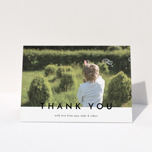 A communion thank you card design titled "Cross Border". It is an A6 card in a landscape orientation. It is a photographic communion thank you card with room for 1 photo. "Cross Border" is available as a folded card, with mainly white colouring.
