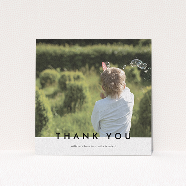 A communion thank you card template titled "Cross Border". It is a square (148mm x 148mm) card in a square orientation. It is a photographic communion thank you card with room for 1 photo. "Cross Border" is available as a flat card, with mainly white colouring.