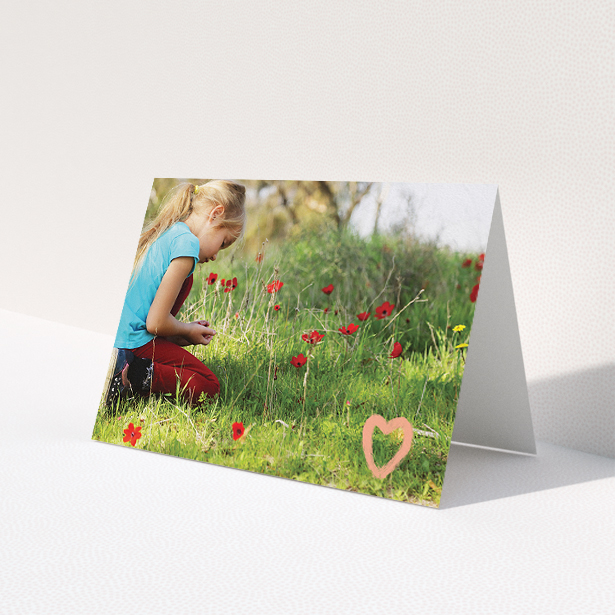 A communion thank you card called 'Hand Drawn Heart'. It is an A5 card in a landscape orientation. It is a photographic communion thank you card with room for 1 photo. 'Hand Drawn Heart' is available as a folded card, with tones of white and pink.