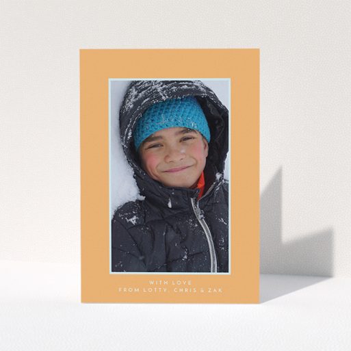 A communion thank you card design titled "Orange and Mint". It is an A5 card in a portrait orientation. It is a photographic communion thank you card with room for 1 photo. "Orange and Mint" is available as a folded card, with tones of orange and blue.