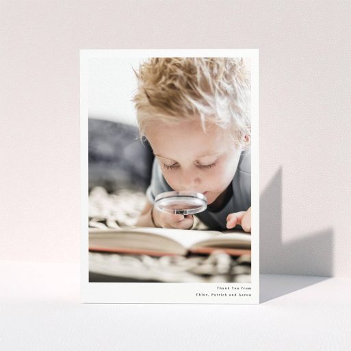 Communion Thank You Card Design - "Simple Portrait" A communion thank you card named "Simple Portrait". It is an A5 card in a portrait orientation. It is a photographic communion thank you card with room for 1 photo. "Simple Portrait" is available as a folded card, with mainly white colouring.
