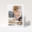 A communion thank you card named "Simple Portrait". It is an A5 card in a portrait orientation. It is a photographic communion thank you card with room for 1 photo. "Simple Portrait" is available as a folded card, with mainly white colouring.