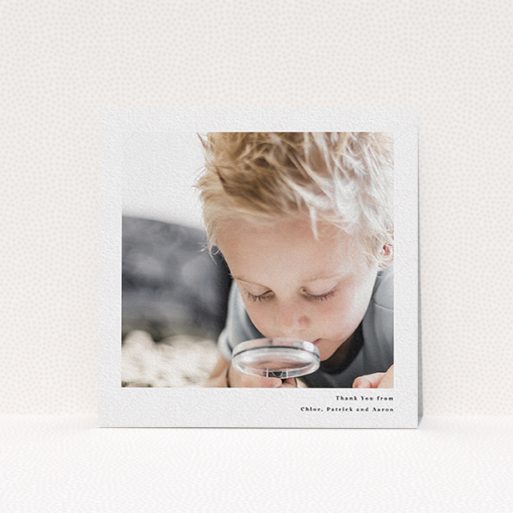 A communion thank you card design titled "Simple Portrait". It is a square (148mm x 148mm) card in a square orientation. It is a photographic communion thank you card with room for 1 photo. "Simple Portrait" is available as a flat card, with mainly white colouring.