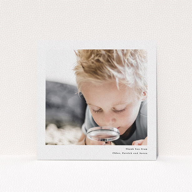 A communion thank you card design titled "Simple Portrait". It is a square (148mm x 148mm) card in a square orientation. It is a photographic communion thank you card with room for 1 photo. "Simple Portrait" is available as a flat card, with mainly white colouring.