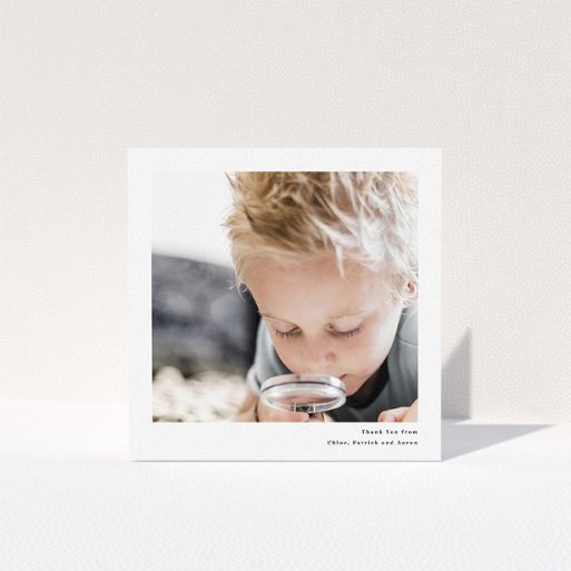 A communion thank you card design titled "Simple Portrait". It is a square (148mm x 148mm) card in a square orientation. It is a photographic communion thank you card with room for 1 photo. "Simple Portrait" is available as a folded card, with mainly white colouring.