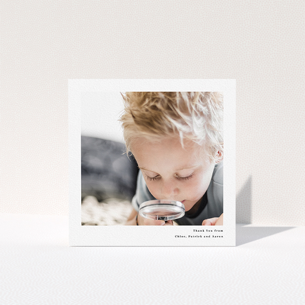 A communion thank you card design titled "Simple Portrait". It is a square (148mm x 148mm) card in a square orientation. It is a photographic communion thank you card with room for 1 photo. "Simple Portrait" is available as a folded card, with mainly white colouring.