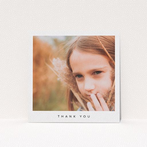 A communion thank you card named "Simple Thanks". It is a square (148mm x 148mm) card in a square orientation. It is a photographic communion thank you card with room for 1 photo. "Simple Thanks" is available as a flat card, with mainly white colouring.