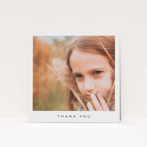 A communion thank you card named "Simple Thanks". It is a square (148mm x 148mm) card in a square orientation. It is a photographic communion thank you card with room for 1 photo. "Simple Thanks" is available as a flat card, with mainly white colouring.