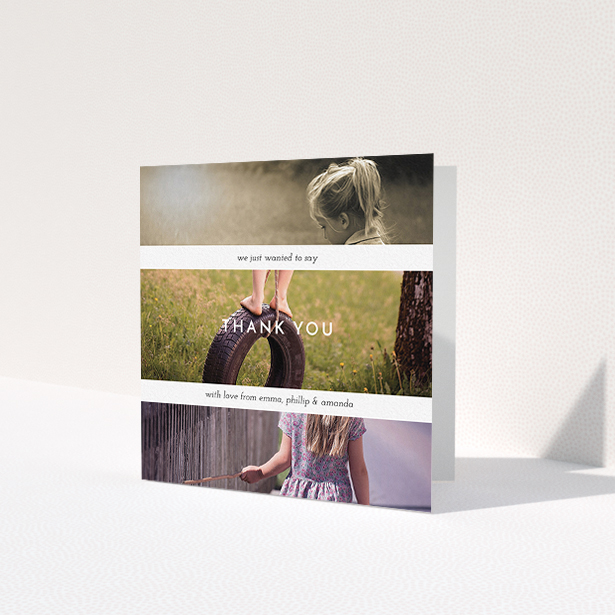 A communion thank you card named 'Stacked Landscapes'. It is a square (148mm x 148mm) card in a square orientation. It is a photographic communion thank you card with room for 3 photos. 'Stacked Landscapes' is available as a folded card, with mainly white colouring.