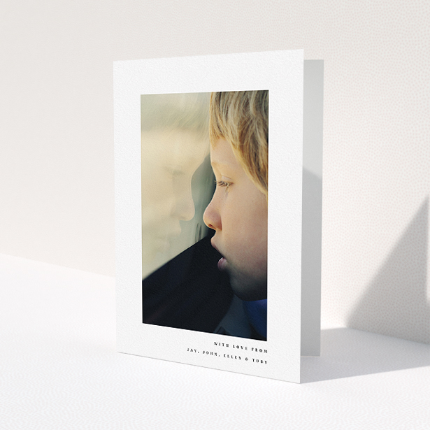 A communion thank you card called "Thin Blue Frame". It is an A5 card in a portrait orientation. It is a photographic communion thank you card with room for 1 photo. "Thin Blue Frame" is available as a folded card, with mainly white colouring.