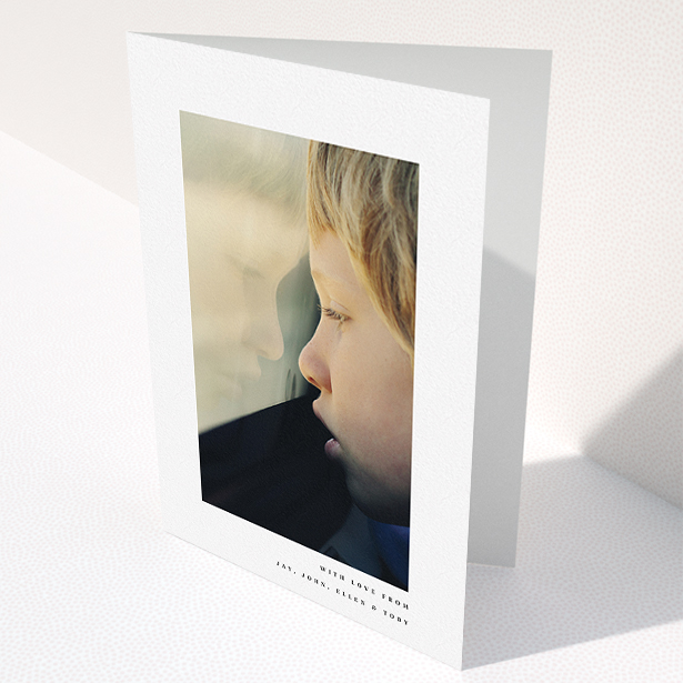 A communion thank you card called "Thin Blue Frame". It is an A5 card in a portrait orientation. It is a photographic communion thank you card with room for 1 photo. "Thin Blue Frame" is available as a folded card, with mainly white colouring.