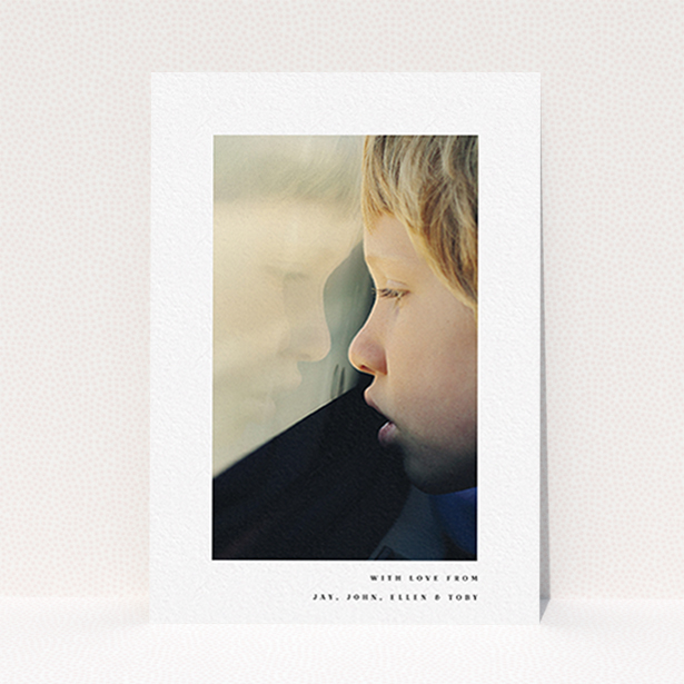 A communion thank you card template titled "Thin Blue Frame". It is an A6 card in a portrait orientation. It is a photographic communion thank you card with room for 1 photo. "Thin Blue Frame" is available as a flat card, with mainly white colouring.