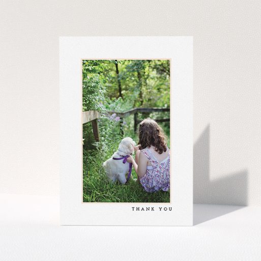 A communion thank you card design called "Thin Pink Frame". It is an A5 card in a portrait orientation. It is a photographic communion thank you card with room for 1 photo. "Thin Pink Frame" is available as a folded card, with tones of white and pink.