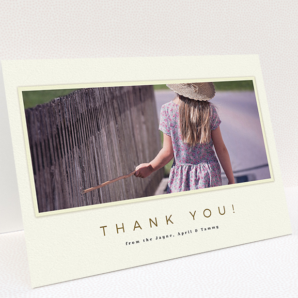A communion thank you card design titled "Torn Cream Frame". It is an A5 card in a landscape orientation. It is a photographic communion thank you card with room for 1 photo. "Torn Cream Frame" is available as a folded card, with mainly cream colouring.