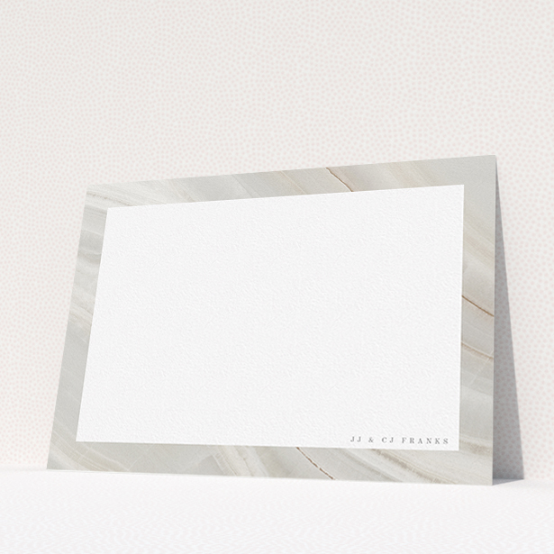 A couples custom writing stationery called "Swells of marble". It is an A5 card in a landscape orientation. "Swells of marble" is available as a flat card, with tones of grey and white.