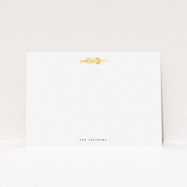 A couples custom writing stationery design called "Tie the knot". It is an A5 card in a landscape orientation. "Tie the knot" is available as a flat card, with tones of white and orange.