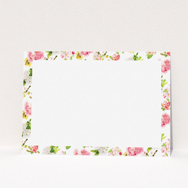 A couples personalised note card design named "Blurred blossom". It is an A5 card in a landscape orientation. "Blurred blossom" is available as a flat card, with tones of pink, green and yellow.