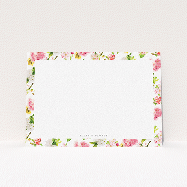 A couples personalised note card design called "Blurred blossom". It is an A6 card in a landscape orientation. "Blurred blossom" is available as a flat card, with tones of pink, green and yellow.