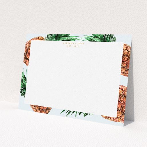 A couples personalised note card design titled 'Falling pineapples'. It is an A5 card in a landscape orientation. 'Falling pineapples' is available as a flat card, with tones of blue, green and brown.