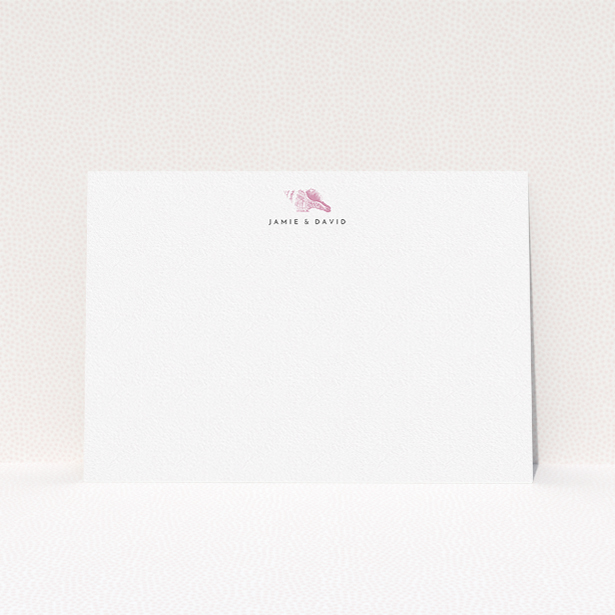 A couples personalised note card design named "Found on the shore". It is an A5 card in a landscape orientation. "Found on the shore" is available as a flat card, with tones of white and pink.