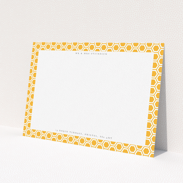 A couples personalised note card called "Geometric hive". It is an A5 card in a landscape orientation. "Geometric hive" is available as a flat card, with tones of orange and white.