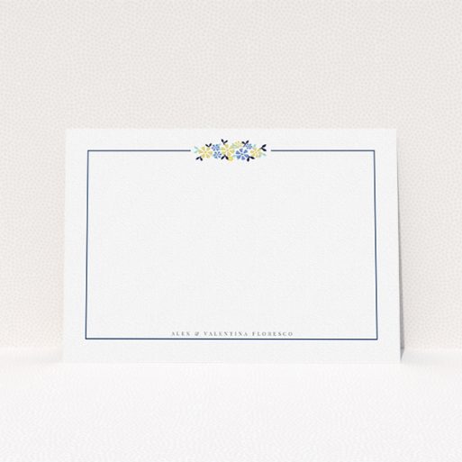 A couples personalised note card design called "Surrounded by flowers". It is an A5 card in a landscape orientation. "Surrounded by flowers" is available as a flat card, with tones of white and blue.