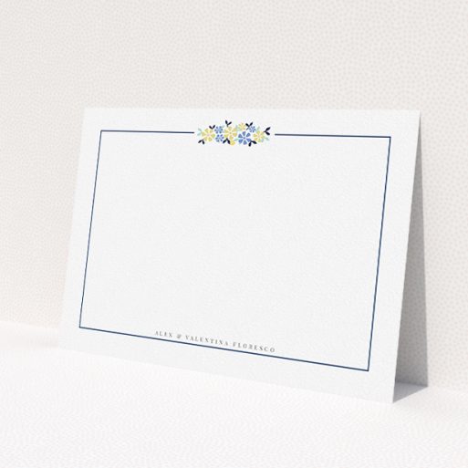 A couples personalised note card design called 'Surrounded by flowers'. It is an A5 card in a landscape orientation. 'Surrounded by flowers' is available as a flat card, with tones of white and blue.