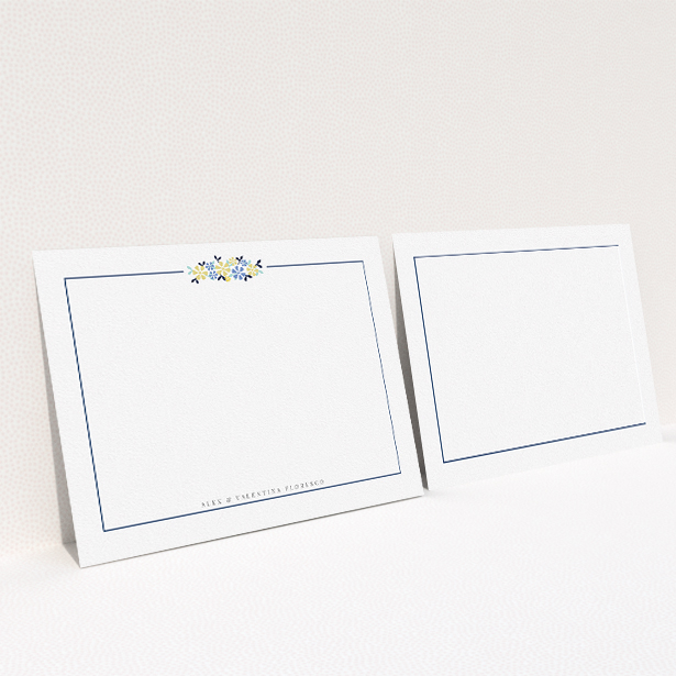 A couples personalised note card design called "Surrounded by flowers". It is an A5 card in a landscape orientation. "Surrounded by flowers" is available as a flat card, with tones of white and blue.