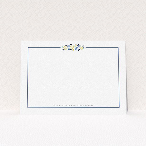 A couples personalised note card design titled "Surrounded by flowers". It is an A6 card in a landscape orientation. "Surrounded by flowers" is available as a flat card, with tones of white and blue.