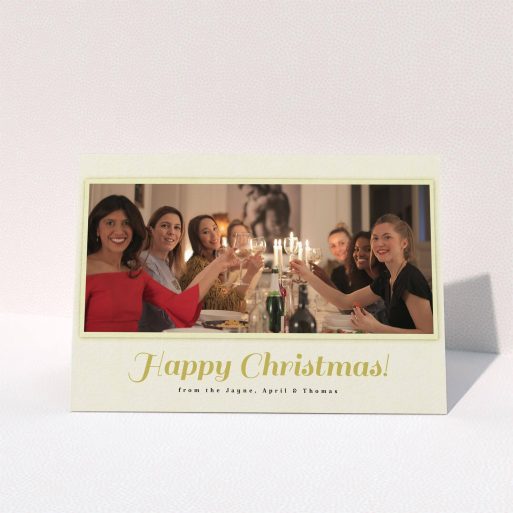 A custom christmas card design named "Champagne". It is an A6 card in a landscape orientation. It is a photographic custom christmas card with room for 1 photo. "Champagne" is available as a folded card, with mainly cream colouring.