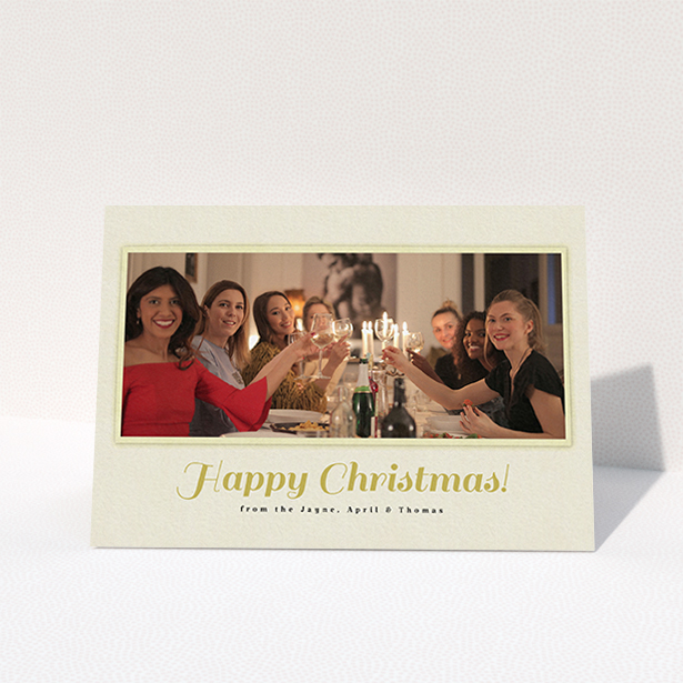 A custom christmas card design named "Champagne". It is an A6 card in a landscape orientation. It is a photographic custom christmas card with room for 1 photo. "Champagne" is available as a folded card, with mainly cream colouring.