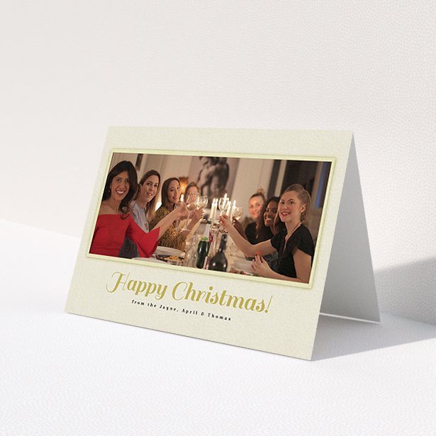 A custom christmas card design named 'Champagne'. It is an A6 card in a landscape orientation. It is a photographic custom christmas card with room for 1 photo. 'Champagne' is available as a folded card, with mainly cream colouring.
