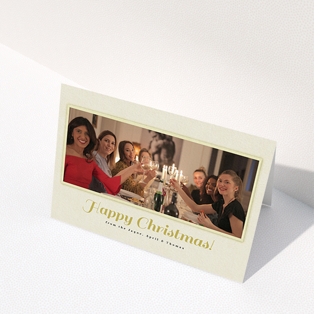 A custom christmas card design named "Champagne". It is an A6 card in a landscape orientation. It is a photographic custom christmas card with room for 1 photo. "Champagne" is available as a folded card, with mainly cream colouring.