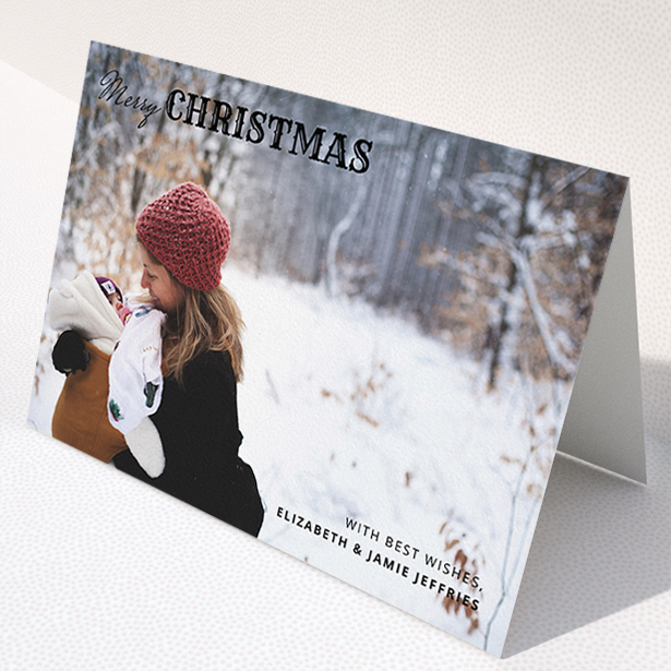 A custom christmas card design titled "Christmas Corners". It is an A5 card in a landscape orientation. It is a photographic custom christmas card with room for 1 photo. "Christmas Corners" is available as a folded card, with mainly black colouring.