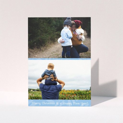 A custom christmas card design titled "Christmas Morning". It is an A6 card in a portrait orientation. It is a photographic custom christmas card with room for 2 photos. "Christmas Morning" is available as a folded card, with mainly blue colouring.