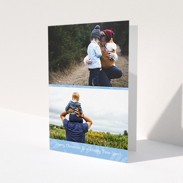 A custom christmas card design titled 'Christmas Morning'. It is an A6 card in a portrait orientation. It is a photographic custom christmas card with room for 2 photos. 'Christmas Morning' is available as a folded card, with mainly blue colouring.