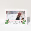 A custom christmas card design named "Holly Sides". It is an A5 card in a landscape orientation. It is a photographic custom christmas card with room for 1 photo. "Holly Sides" is available as a folded card, with tones of white, green and red.