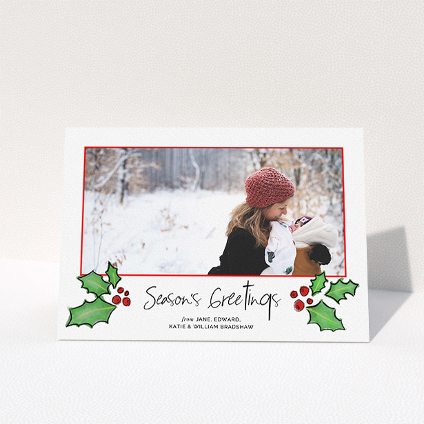 A custom christmas card design named "Holly Sides". It is an A5 card in a landscape orientation. It is a photographic custom christmas card with room for 1 photo. "Holly Sides" is available as a folded card, with tones of white, green and red.