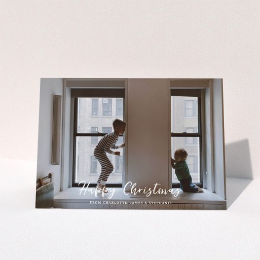 A custom christmas card called "Photo Message". It is an A5 card in a landscape orientation. It is a photographic custom christmas card with room for 1 photo. "Photo Message" is available as a folded card, with mainly white colouring.