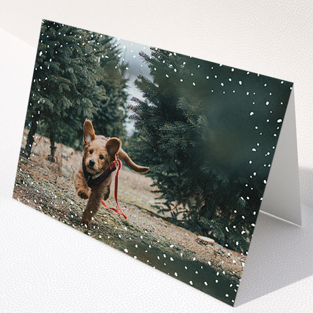 A custom christmas card design titled "Simple Snow Photo". It is an A5 card in a landscape orientation. It is a photographic custom christmas card with room for 1 photo. "Simple Snow Photo" is available as a folded card, with mainly white colouring.
