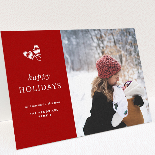 A custom christmas card design named "Warm Mittens". It is an A5 card in a landscape orientation. It is a photographic custom christmas card with room for 1 photo. "Warm Mittens" is available as a folded card, with tones of red and white.