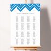 Custom Seating Charts - Skiapthos featuring a summery seating plan design inspired by the Greek islands, with a blue and white painted pattern at the top of the board, bringing the beauty of the Mediterranean to your event.. This design has 16 tables.