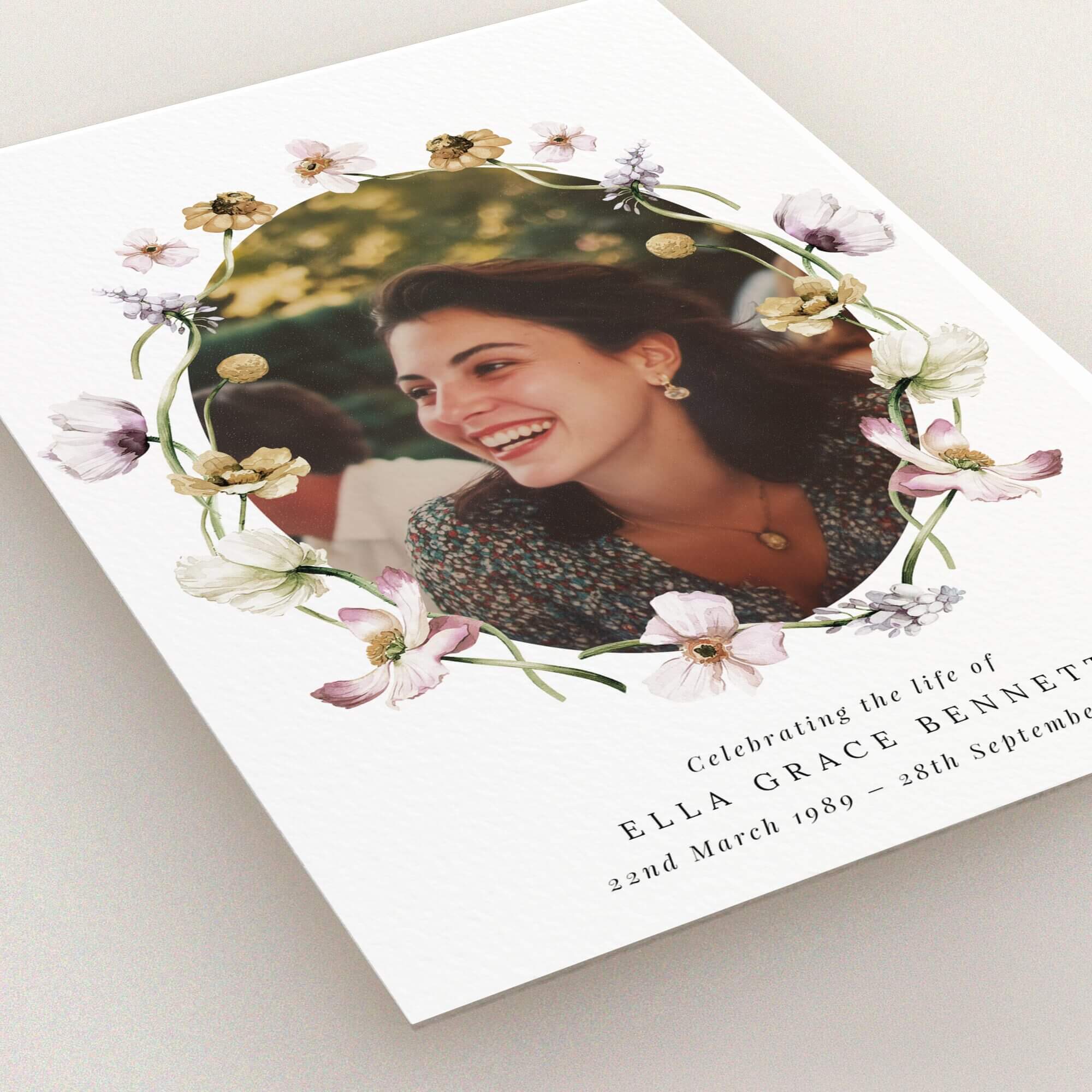 Floral funeral announcement design with one photo.