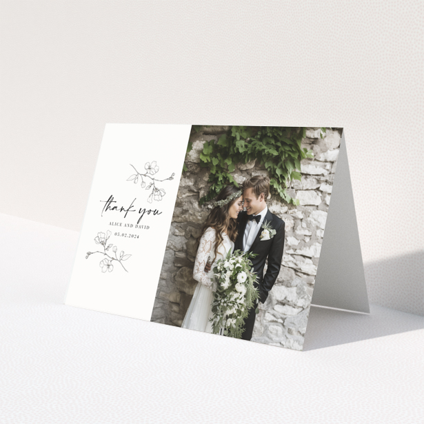 Wedding thank you card with floral illustrations and one photo of a smiling couple