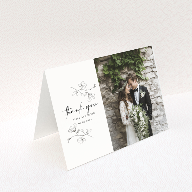 Wedding thank you card with floral illustrations and one photo of a smiling couple