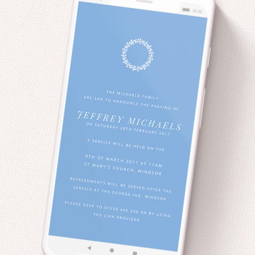 A digital funeral invite design called 'Floral Wreath in White'. It is a smartphone screen sized invite in a portrait orientation. 'Floral Wreath in White' is available as a flat invite, with tones of blue and white.