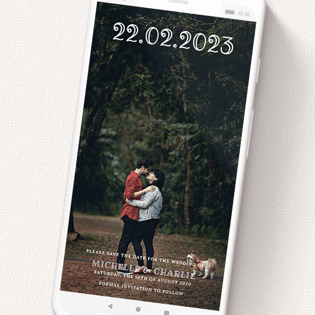 A digital save the date named 'Bristolian'. It is a smartphone screen sized save the date in a portrait orientation. It is a photographic digital save the date with room for 1 photo. 'Bristolian' is available as a flat save the date, with mainly white colouring.